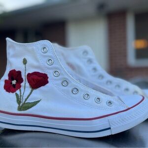 White High Top Converses with hand stitched poppies on sides.